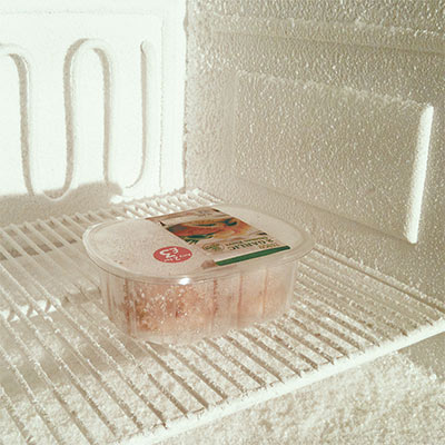 Snow sprayed into an old fridge for use in an advert