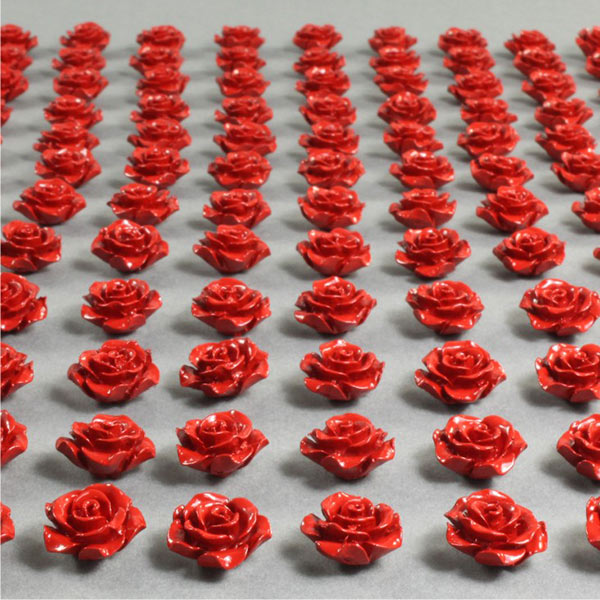 Spin cast white metal roses