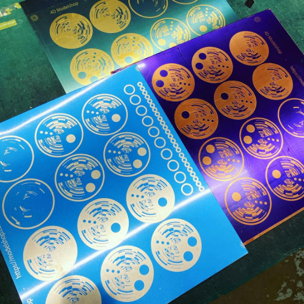 0.45mm brass, copper and nickel silver sheet being prepared for the photo etching process