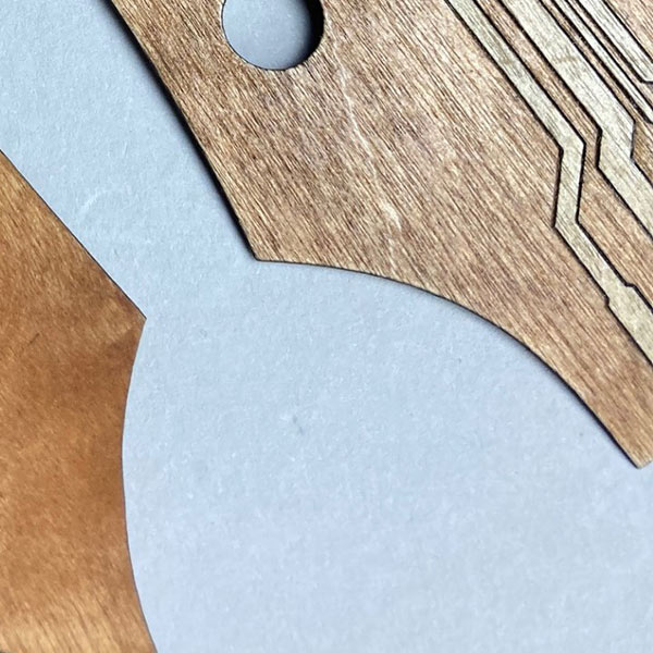 Laser engraved plywood guitar headstock cover