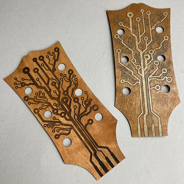Laser engraved plywood guitar headstock cover