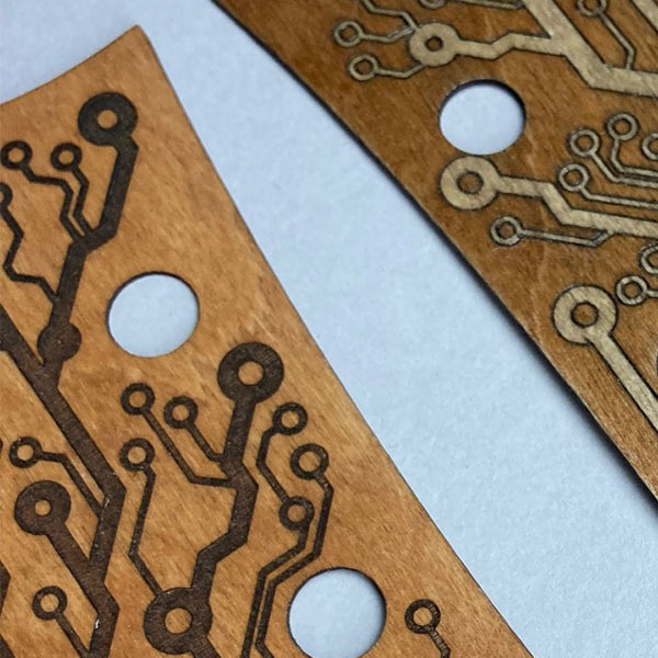 Laser engraved plywood guitar headstock cover