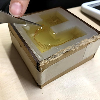 Use of resin encapulation for architectural models