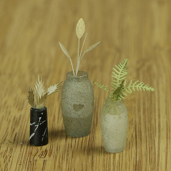 Miniature indoor plants and vase