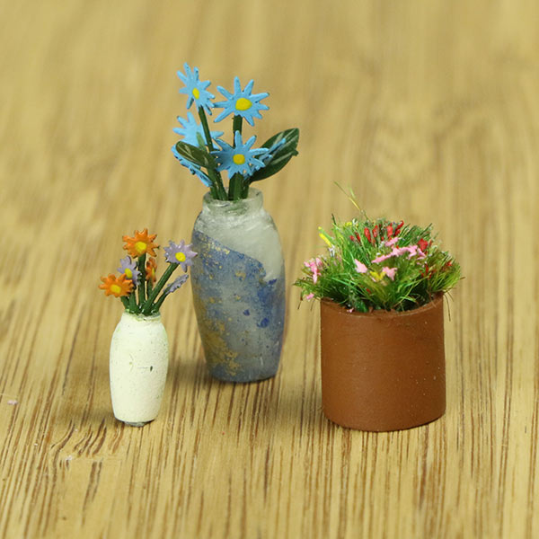 Miniature indoor plants and vase