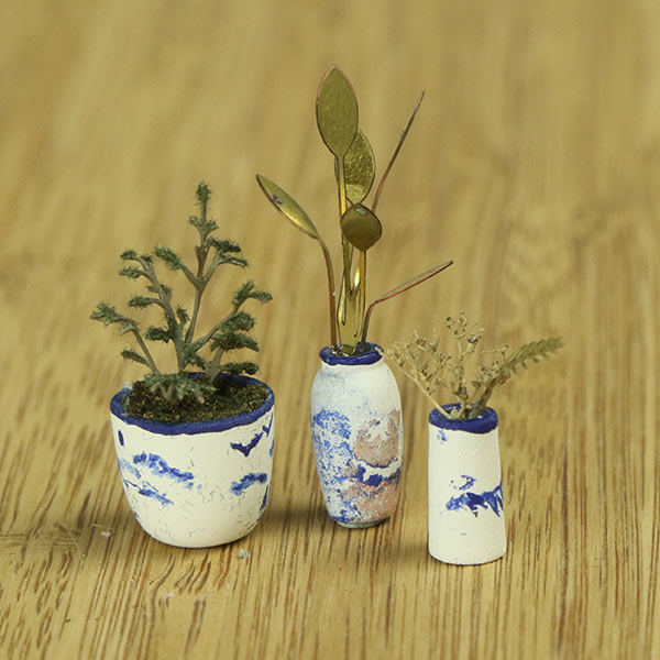 Miniature indoor plants and vase