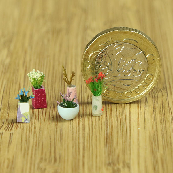 Miniature indoor plants and vase